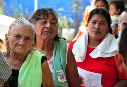 Women from the town of El Achiotal, El Salvador, await their turn in line at the pharmacy during a Medical Civil Action Program (MEDCAP) here. The two-day medical mission offered residents affected by November flooding and mudslides the opportunity to receive medical care, immunizations, education, and prescription drugs free of charge. It was a combined effort between the Salvadoran government, the U.S. Embassy in El Salvador, and U.S. Southern Command’s Joint Task Force-Bravo – based at Soto Cano Air Base, Honduras. More than 1,300 patients were seen in the two days. (U.S. Air Force photo/Tech. Sgt. Mike Hammond) 