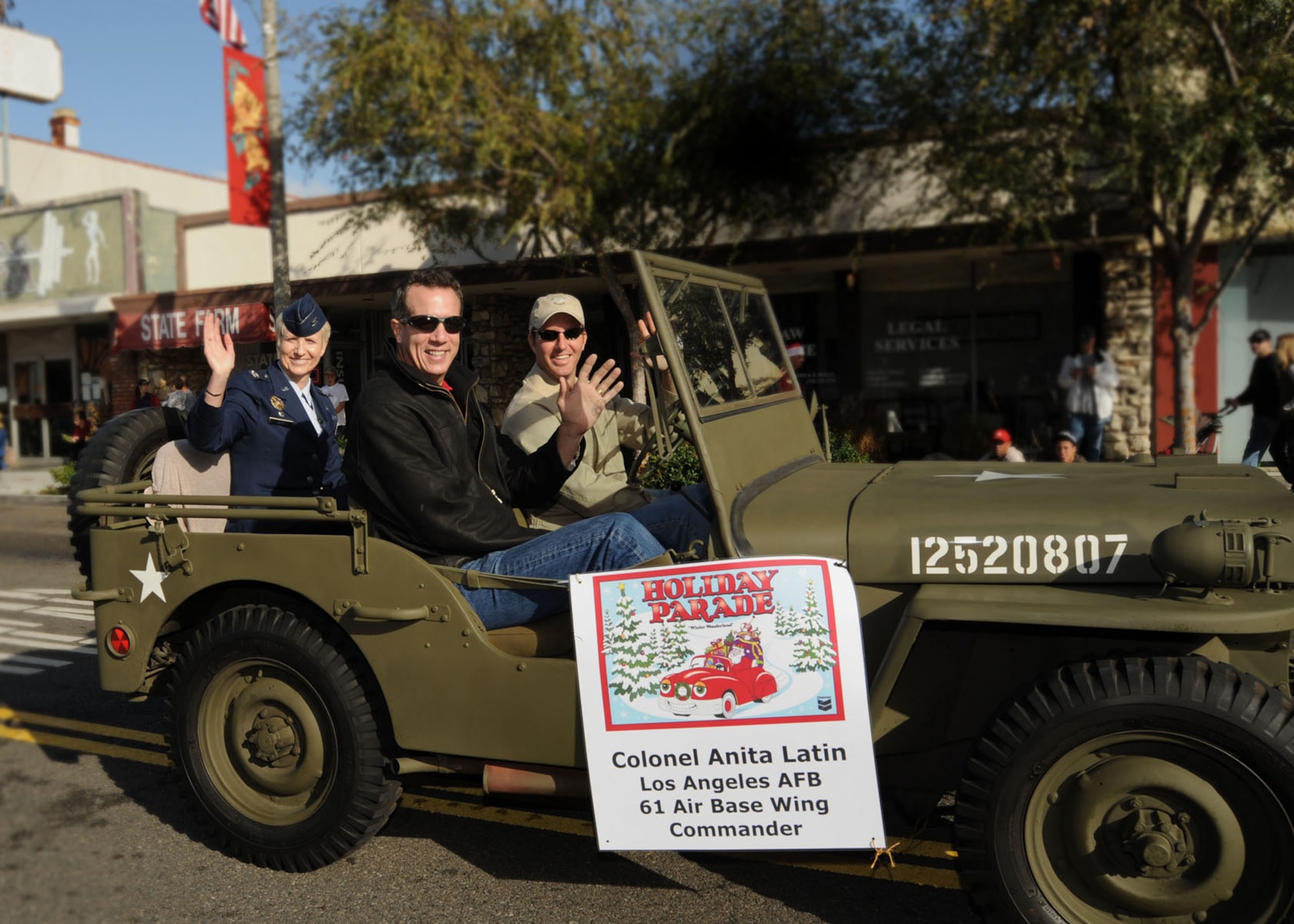 Col. Anita Latin, 61st Air Base Wing commander, and her husband Lyle Cantrell rode in a vintage jeep in El Segundo’s annual Holiday Parade, Dec. 13. (Photo by Lou Hernandez)