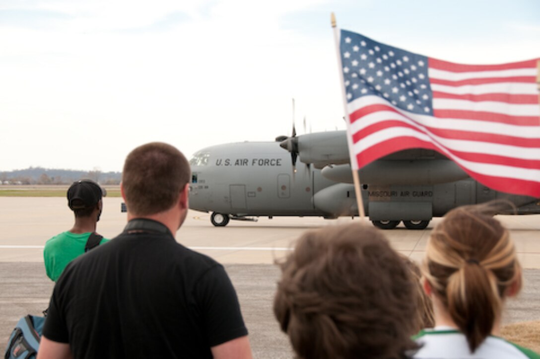 Guard members and families of the 139th Airlift Wing, Security Forces Squadron, wait for their colleagues s and loved ones as they return from a one year deployment on Friday, November 6, 2009. (US Air Force photo by MSgt. Shannon Bond) (RELEASED)