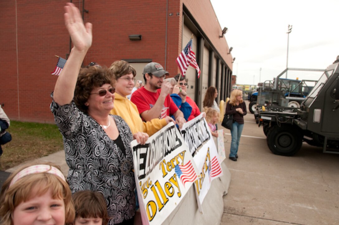 Guard members and families of the 139th Airlift Wing, Security Forces Squadron, wait for their colleagues s and loved ones as they return from a one year deployment on Friday, November 6, 2009. (US Air Force photo by MSgt. Shannon Bond) (RELEASED)