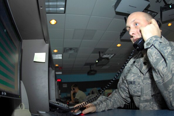 MINOT AIR FORCE BASE, N.D. -- Senior Airman Gary Conlee, 91st Security Support Squadron travel control center control technician, makes adjustments to a missile field convoy Dec. 10 here. Airman Conlee was recently awarded the bronze star for meritorious service with the 855th Air Expeditionary Wing at Bagram Air Base, Afghanistan. (U.S. Air Force photo by Airman 1st Class Benjamin Stratton)