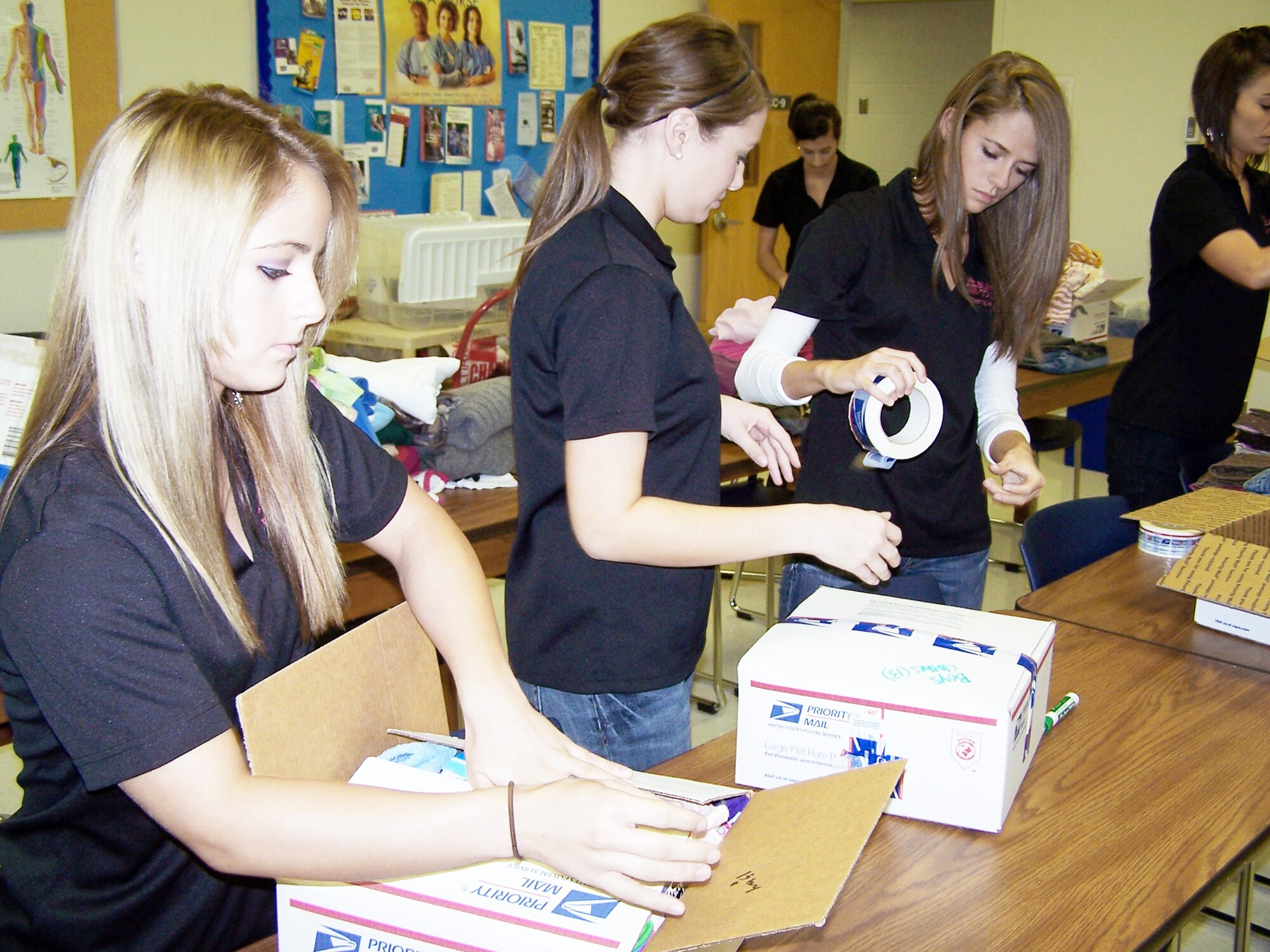 Blinn College dental hygiene program students in put together boxes of clothing, toys and necessities to send to Kyrgyz children at the Nizhanchuisk Village Orphanage and School in Kyrgyzstan Oct. 24, 2009 in Bryan, Texas. The dental students are very active in community service and took time to put together more than 50 boxes to send to Kyrgyzstan in November. (Courtesy photo)