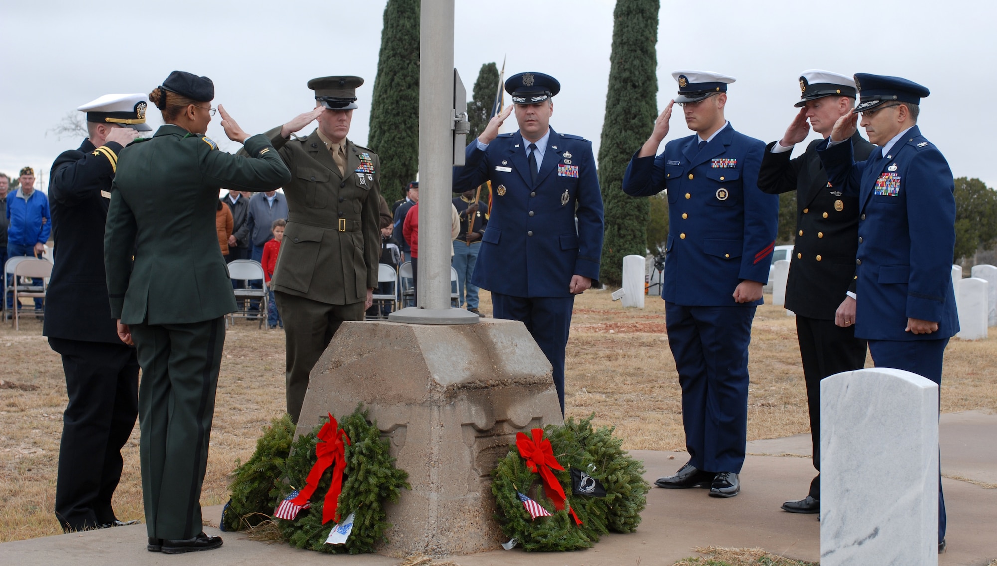 SAN ANGELO, Texas -- Servicemembers from each branch of the Armed Forces render a salute during the Civil Air Patrol's annual Wreaths Across America event at Belvedere Memorial Park, Dec. 12, 2009. This event honors the courage and sacrifice of veterans of the Armed Forces and the Merchant Marine. (U.S. Air Force photo/Staff Sgt. Laura R. McFarlane)
