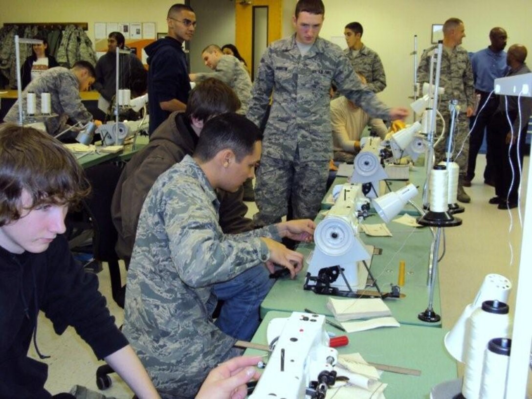 Seventeen delayed enlistment recruits and recruiters of the 344th Recruiting Squadron toured Sheppard Dec. 10.  The group explored aviation maintenance and climbed in the cockpits of various aircraft at the 362nd Training Squadron while learning about parachute packing, life support rafts and sewing machinery at the 361st TRS.  The windshield tour of the 82nd Training Wing and 80th Flying Training Wing included lunch at a dining facility.  (U.S. Air Force Photo/Tech. Sergeant Veronica Drake)