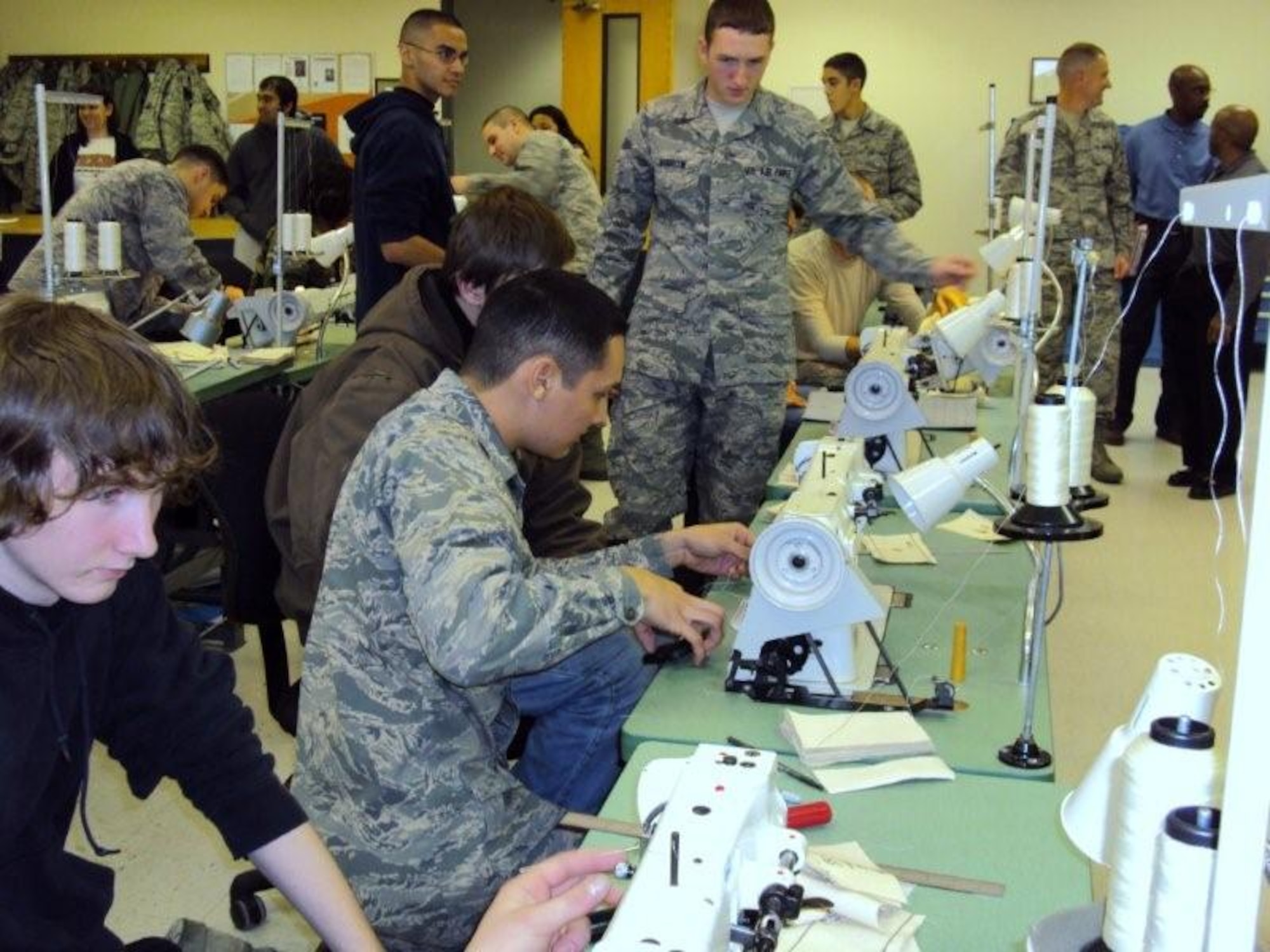 Seventeen delayed enlistment recruits and recruiters of the 344th Recruiting Squadron toured Sheppard Dec. 10.  The group explored aviation maintenance and climbed in the cockpits of various aircraft at the 362nd Training Squadron while learning about parachute packing, life support rafts and sewing machinery at the 361st TRS.  The windshield tour of the 82nd Training Wing and 80th Flying Training Wing included lunch at a dining facility.  (U.S. Air Force Photo/Tech. Sergeant Veronica Drake)