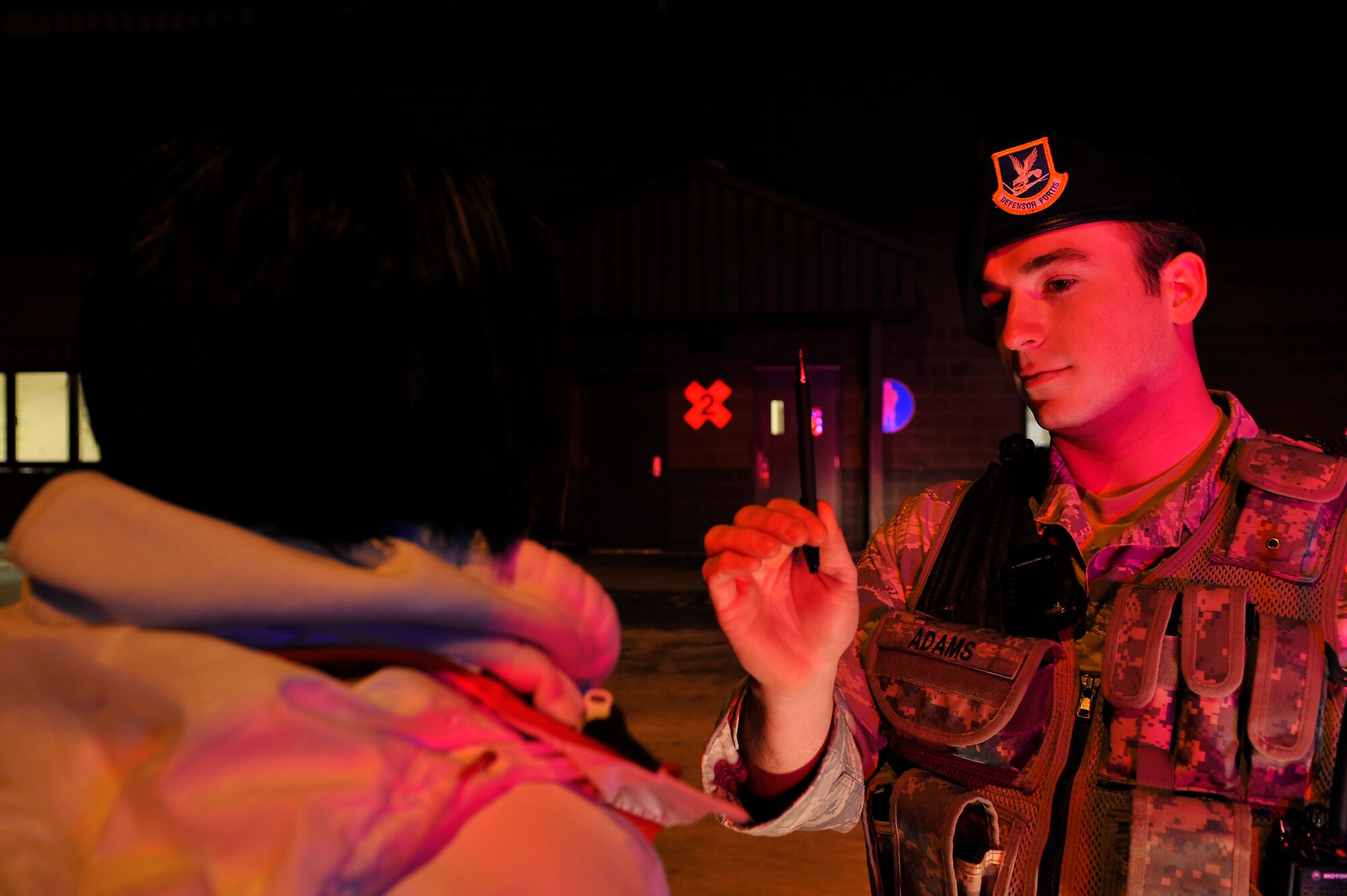 Senior Airman Austin Adams performs a field sobriety test on a mock drunk driver during a FST training scenario Dec. 11, 2009, Eielson Air Force Base, Alaska. The FST training was provided by the North Pole Police Department to give the 354th Security Forces Squadron members the basic tools to recognize a driver under the influence. Airman Austin is assigned to the 354th SFS. (U.S. Air Force photo/Staff Sgt. Christopher Boitz)