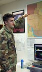 MINOT AIR FORCE BASE, N.D. -- Senior Airman John Read, 5th Operations Support Squadron weather technician, describes the different sections of the 91st Missile Wing missile complex map here Dec. 14. Airman Read is one of the many who support the mission of Minot AFB through his knowledge of climatology. He is a Virginia Air National Guardsman on a temporary duty assignment from the 192nd Fighter Wing at Langley AFB, Va. (U.S. Air Force photo by Airman 1st Class Ashley N. Avecilla)