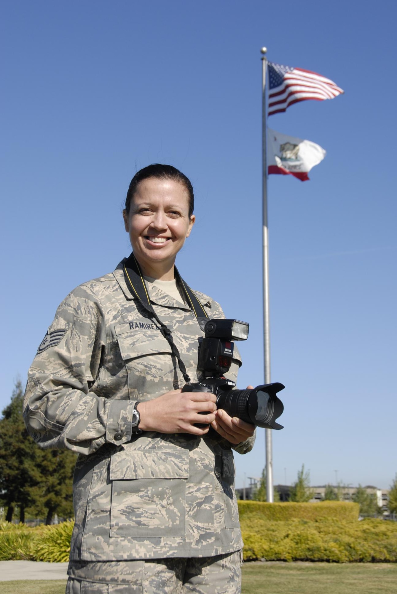 At the World War II Memorial in Washington, D.C., Staff Sgt. Kim Ramirez, 129th Rescue Wing still photographer, came to the aid of an 18-month-old girl who experienced a seizure. The former Army medic’s lifesaving actions earned her the Joint Service Achievement Medal. (Air National Guard photo by Tech. Sgt. Ray Aquino)
