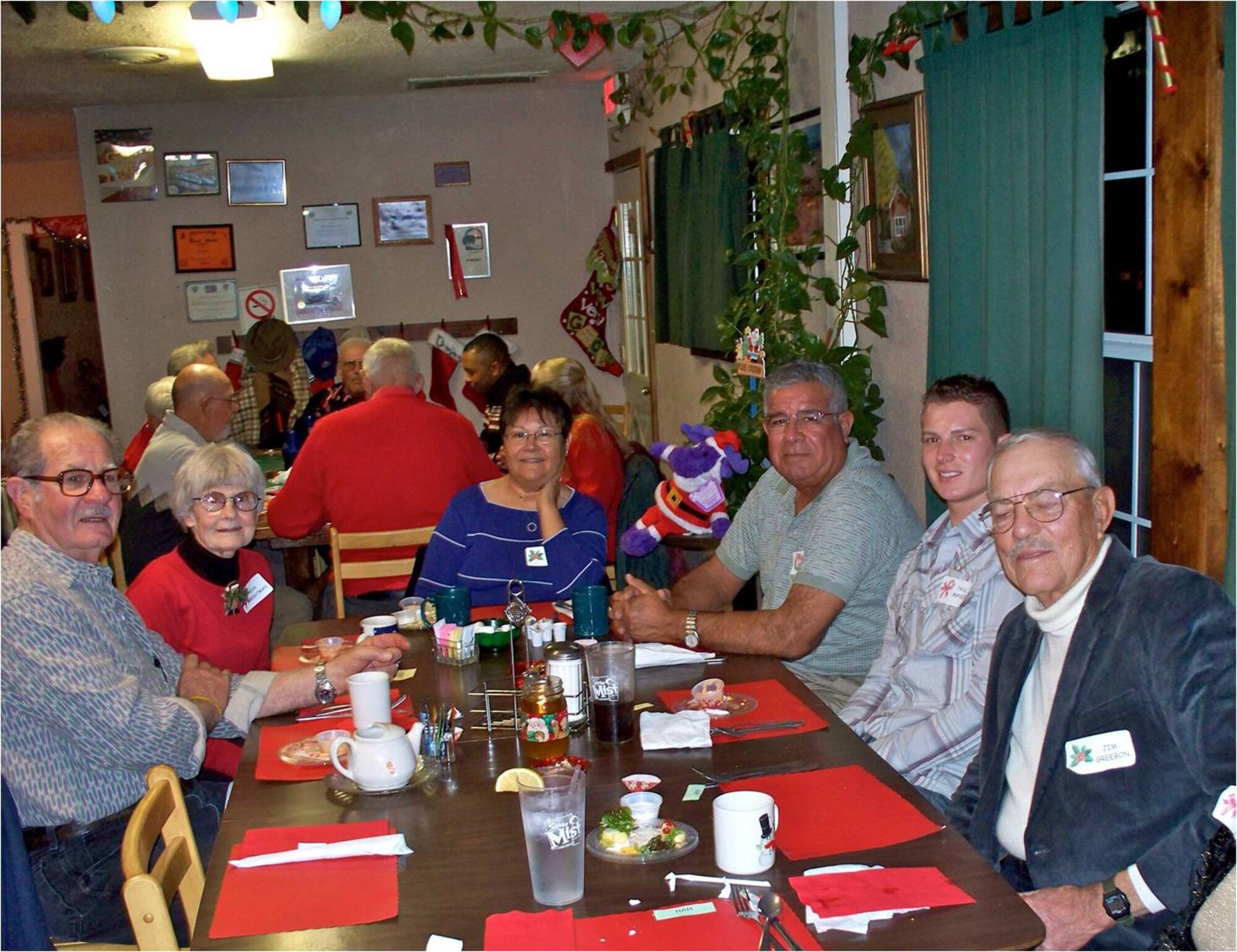 ALAMOGORDO, N.M. -- Active duty and retired Airmen, celebrate the holiday season together at a local restaurant here Dec. 5. The Alamogordo Retired E-9er group hosted 10 Airmen as a part of the Airman and Family Readiness Center's Adopt an Airman program. By signing up for the Adopt an Airman program, people in the local community are given the names of two Airmen to "adopt."  They make the initial contact and host the Airmen for a dinner where they can get to know each other. (Courtesy photo)