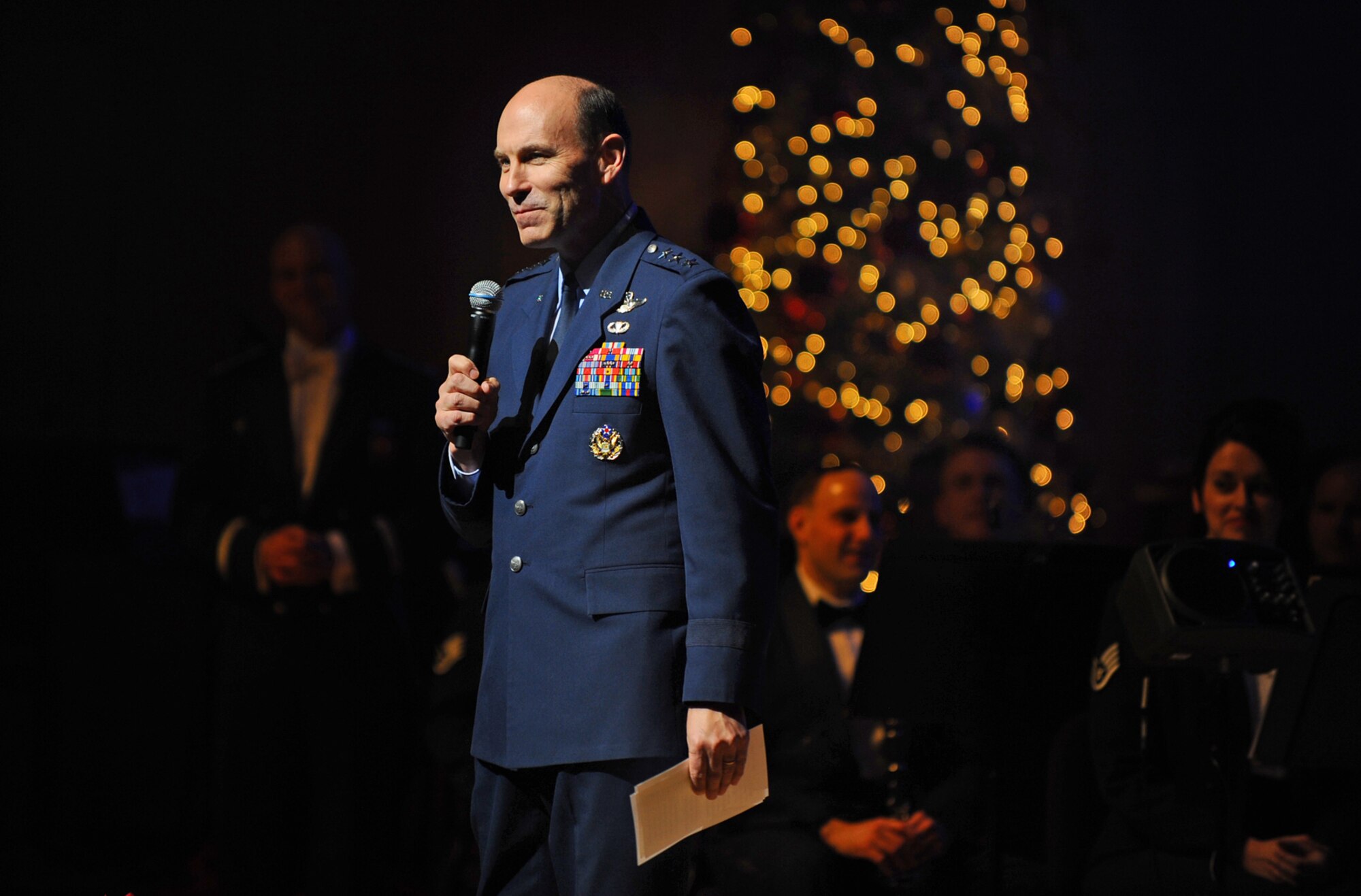 OFFUTT AIR FORCE BASE, Neb.- Lt. Gen. William J. Rew, vice commander of Air Combat Command, delivers opening remarks to a packed Holland Performing Arts Center crowd in Omaha, Neb., Dec. 10 before the start of the Hearltand of America Band's "Here Come the Holidays" concert. The annual concert series consisted of six concerts over four days. U.S. Air Force Photo by Josh Plueger