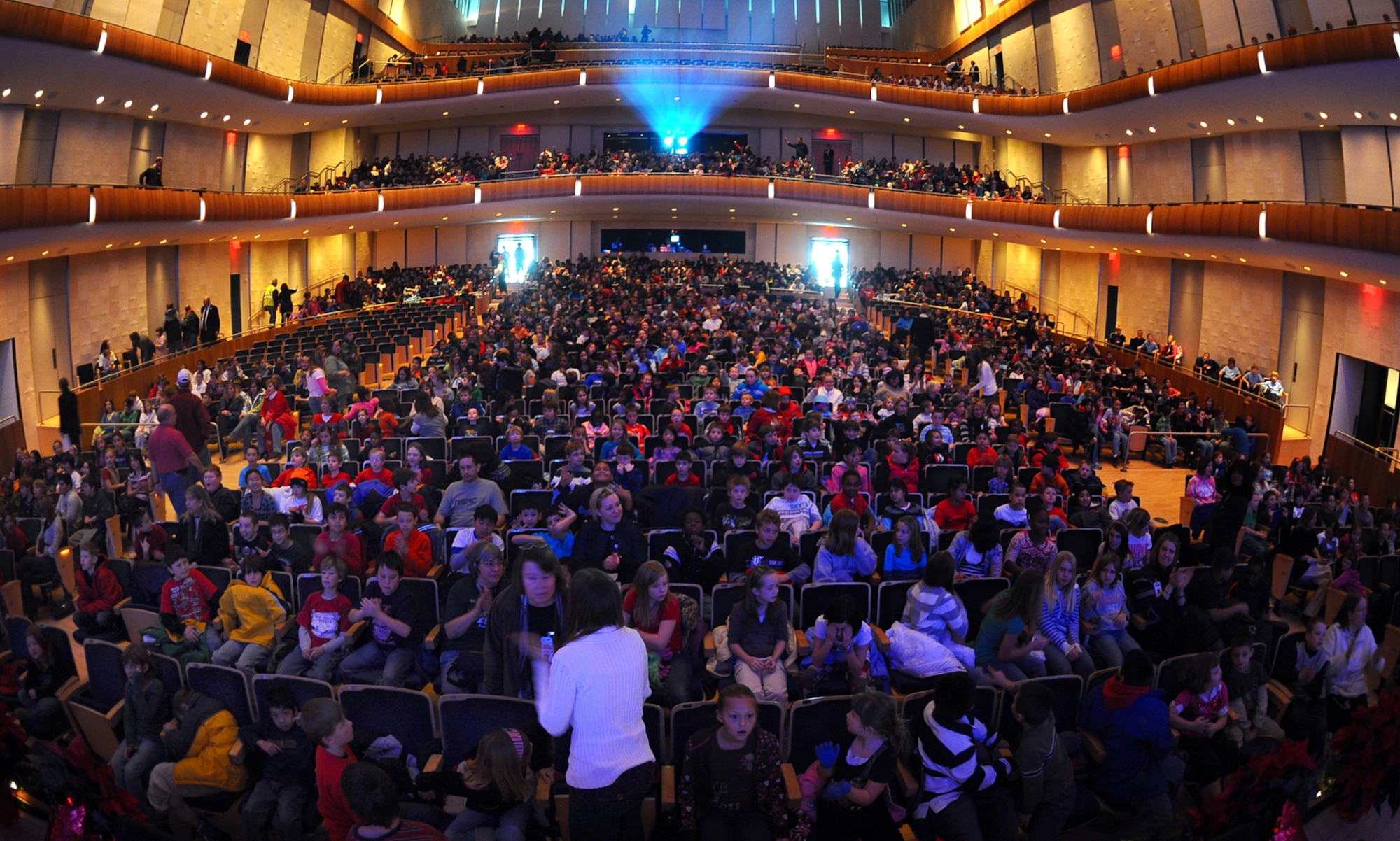 OFFUTT AIR FORCE BASE, Neb. - Elementary school students from the Omaha metro area pile into the Holland Performing Arts Center Dec. 11 for the Heartland of America band's annual holiday concert. The  concert was one of six the HOAB offered over four days. U.S. Air Force Photo by Josh Plueger