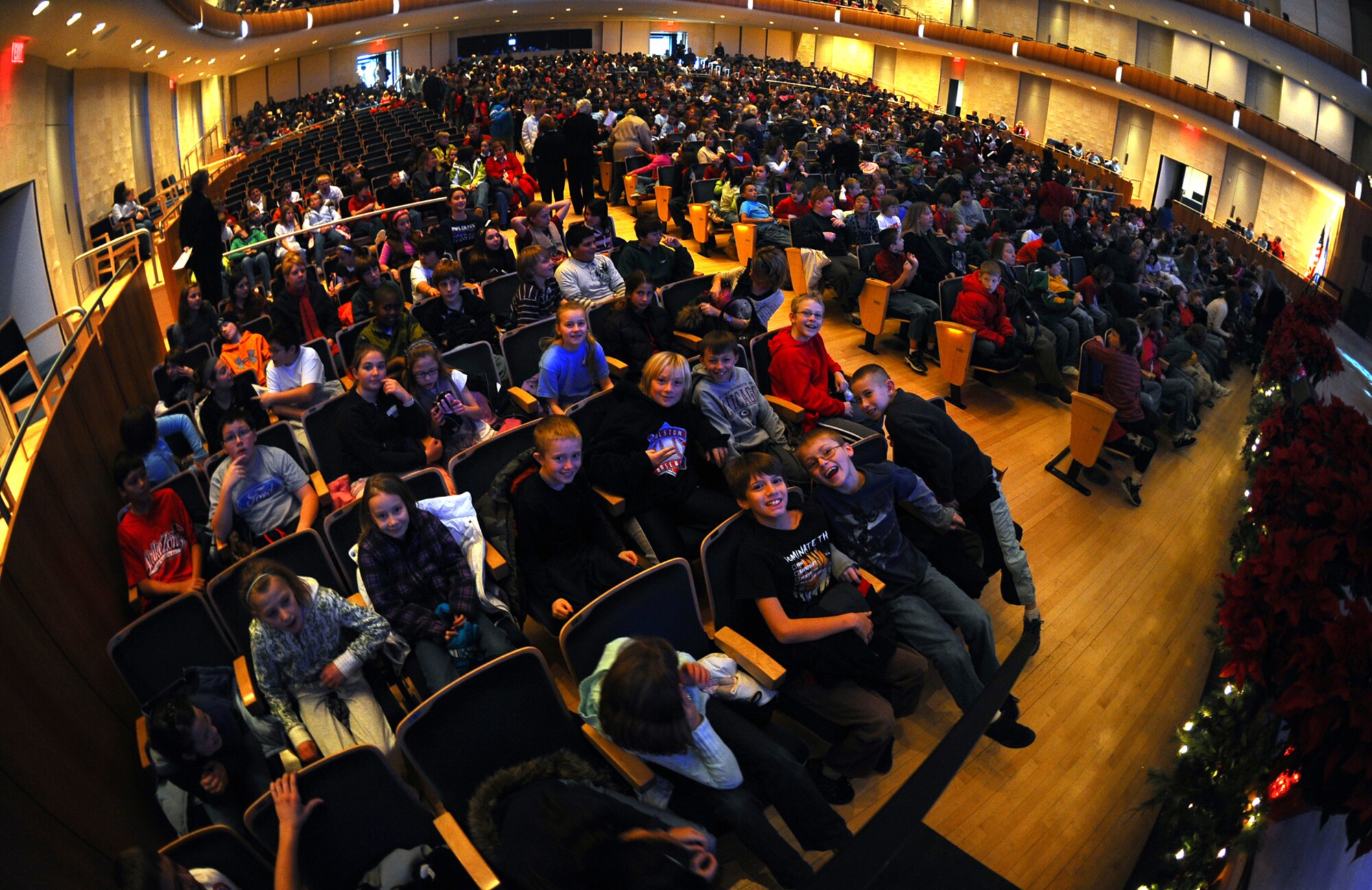 OFFUTT AIR FORCE BASE, Neb. - Elementary school students from the Omaha metro area wait inside the Holland Performing Arts Center in Omaha, Neb., for the Heartland of America band's "Here Come the Holidays" concert to begin Dec. 11.  The annual concert series consisted of six concerts over four days. U.S. Air Force Photo by Josh Plueger