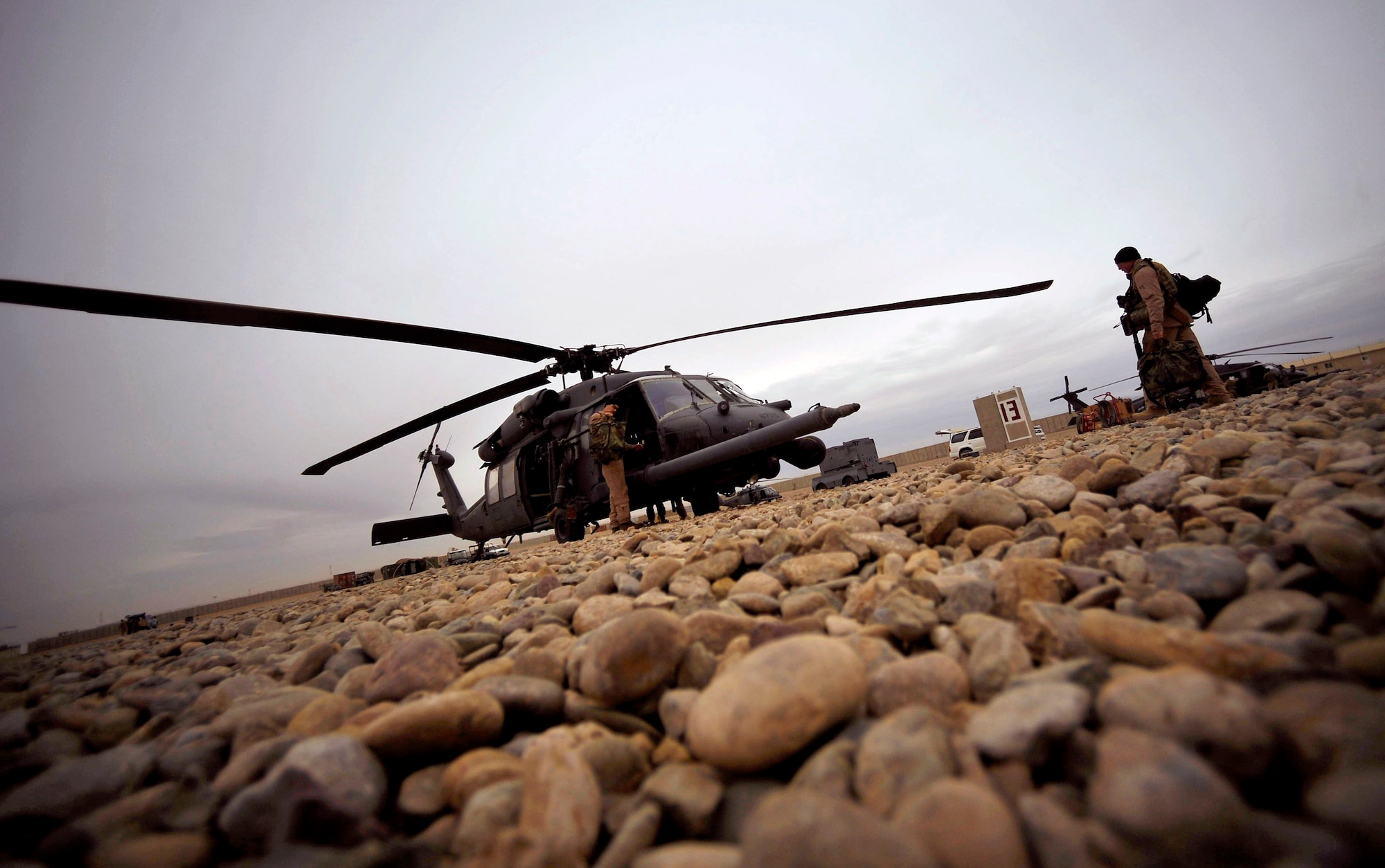 Airmen load their HH-60G Pave Hawk with gear Dec. 8, 2009 at Camp Bastion, Afghanistan. This ensures the team can respond in a moment's notice to rescue a patient and have everything needed to treat them. The Airmen are assigned to the 66th Expeditionary Rescue Squadron. (U.S. Air Force photo/Staff Sgt. Angelita Lawrence)