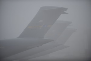 Charleston Air Force Base C-17s sit on the flightline during a foggy morning at Charleston AFB, S.C., Dec. 14, 2009. Charleston AFB is home to the 437th Airlift Wing. The wing has four operational groups consisting of 21 squadrons and one wing staff directorate. Charleston AFB is also host to the 315th Airlift Wing and 17 tenant units. (U.S. Air Force photo by James M. Bowman)(RELEASED)