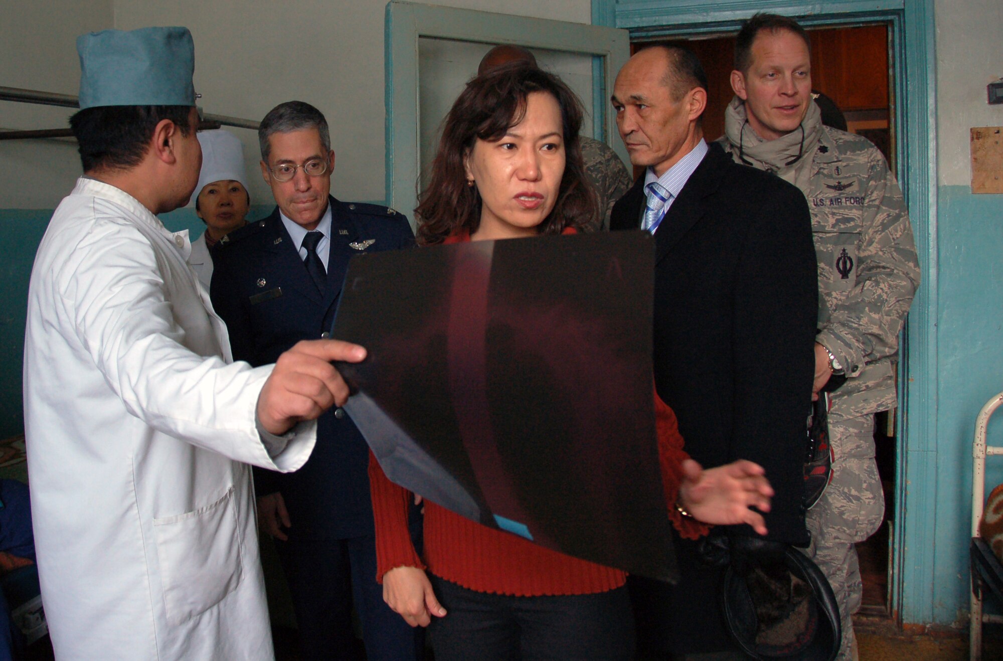 TRANSIT CENTER AT MANAS, Kyrgyzstan- Kyrgyz Dr. Murat Ernazarov shows medical Airmen from the Transit Center at Manas the patients’ ward during a visit to a local Kyrgyz Republic military hospital Dec. 11, 2009. During the visit, the team of Airmen helped out with two surgical operations alongside their Kyrgyz counterparts.  The team of Airmen was led by Colonel Flyer, 376th Expeditionary Medical Group commander. (U.S. Air Force photo/Staff Sgt. Olufemi Owolabi)