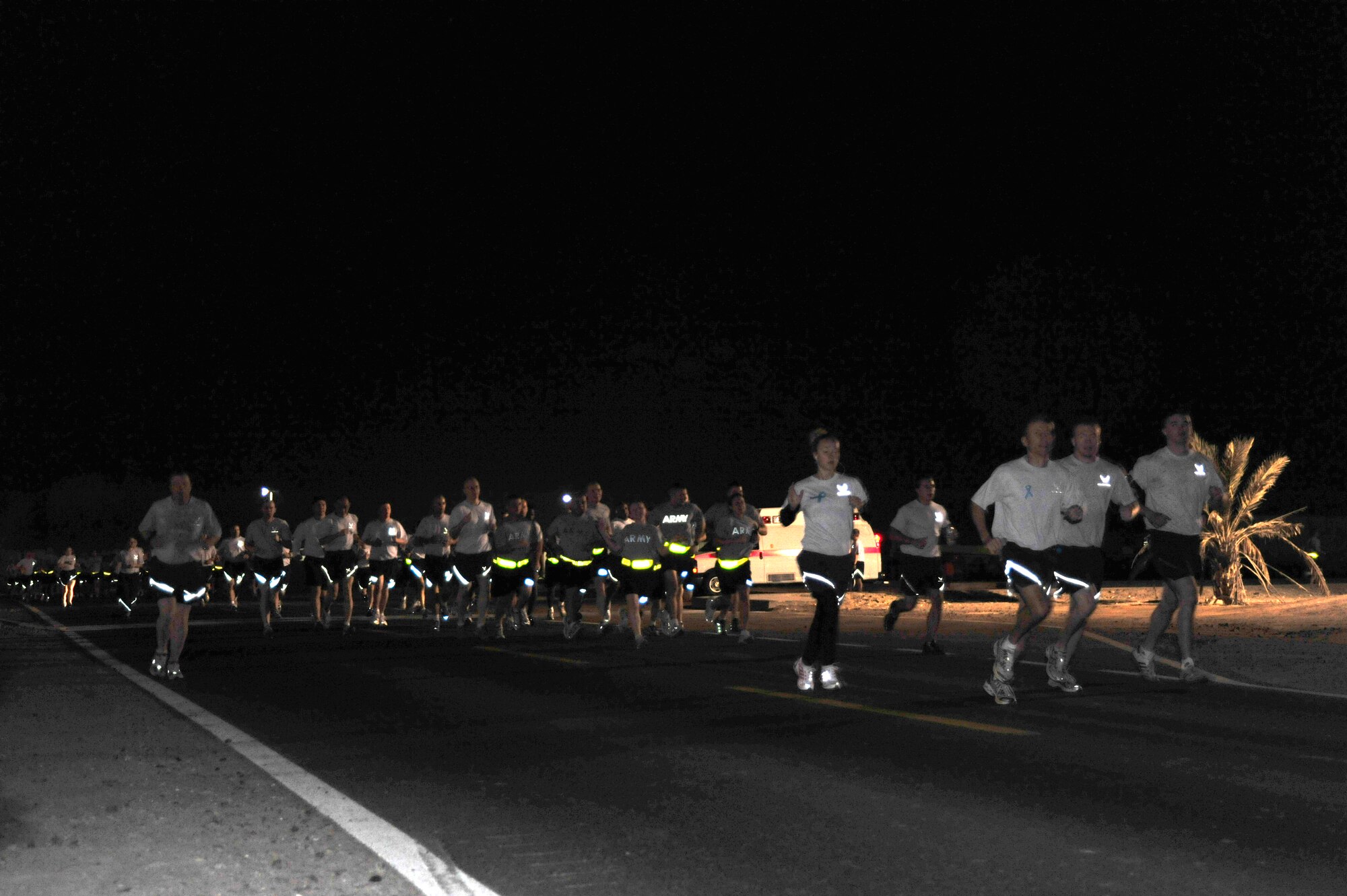 SOUTHWEST ASIA--Airmen, Soldiers and Sailors run during the Run for a Cause
5 and 10k, Dec. 11, 2009. The run was organized by the 380th Air
Expeditionary Wing, sexual assault response and program office, and raised
more than $1,000 to contribute to a charity of the Combined Federal
Campaign. (U.S. Air Force Photo/Tech. Sgt. Charles Larkin Sr) 
