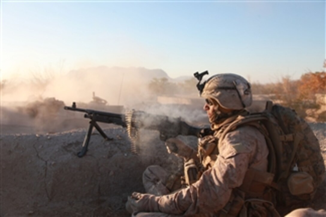 A U.S. Marine with Lima Company, 3rd Battalion, 4th Marine Regiment provides support by fire during Operation Cobra's Anger in Now Zad, Afghanistan, on Dec. 5, 2009.  The Marines are clearing buildings occupied by insurgents.  