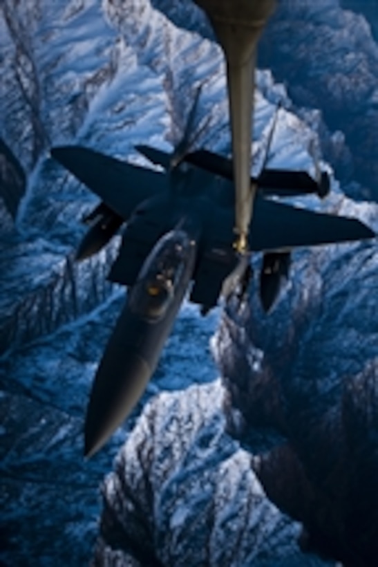 A U.S. Air Force F-15E Strike Eagle aircraft is refueled by a KC-10A Extender aircraft from the 908th Expeditionary Air Refueling Squadron over Afghanistan on Dec. 6, 2009.  