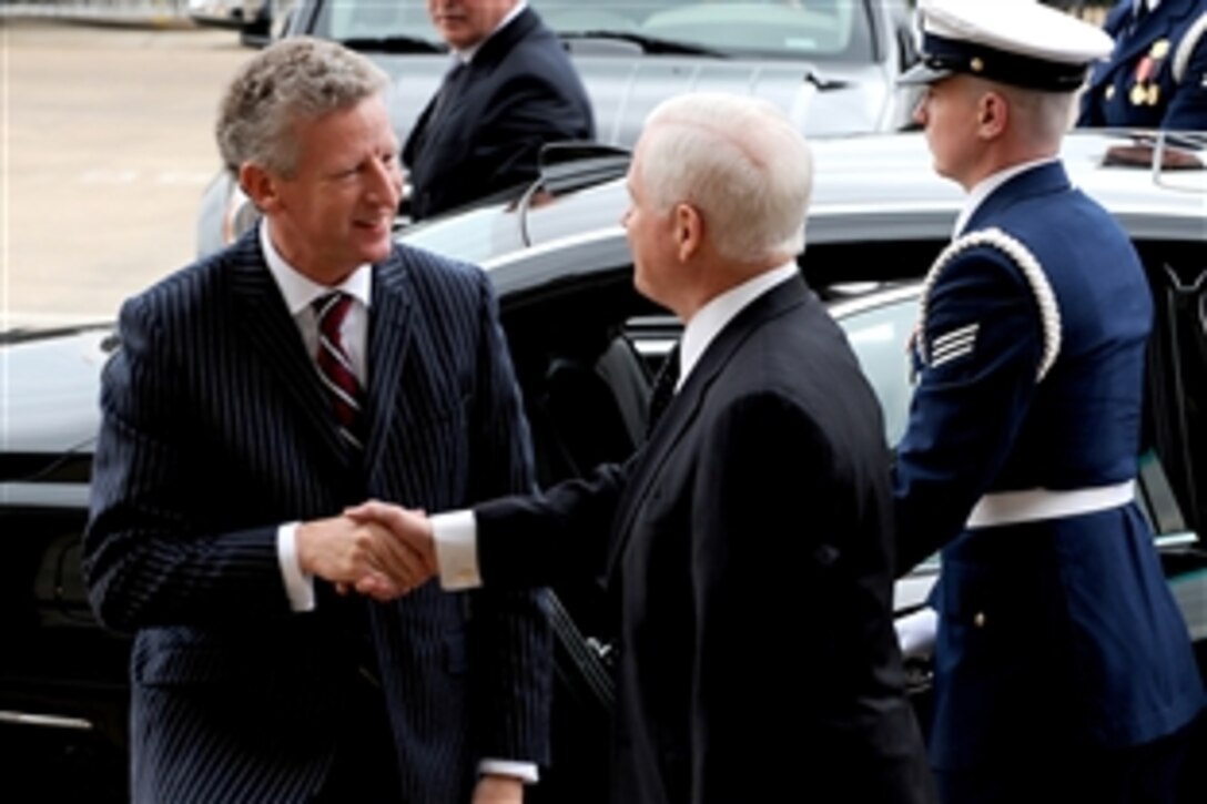Defense Secretary Robert M. Gates, right, welcomes Belgian Defense Minister Peter de Crem to the Pentagon on Dec. 15, 2009, for bilateral security discussions.  