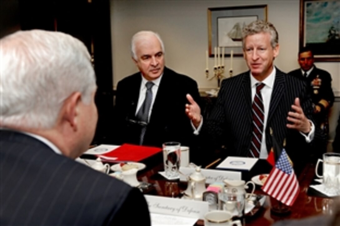 Belgian Minister of Defense Peter de Crem, right, emphasizes a point during security discussions with Defense Secretary Robert M. Gates,  left foreground, at the Pentagon on Dec. 15, 2009. Joining de Crem is the Belgian Ambassador to the United States Jan Matthysen, center.  