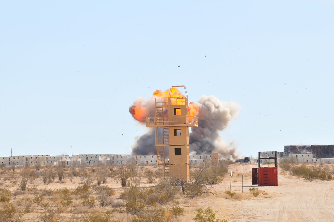 The explosion caused by the two improvised explosive devices built for the Federal Bureau of Investigation’s Large Vehicle Post-Blast Investigation course sent a fireball and debris into the air over the Barry M. Goldwater Range’s Yodaville complex in Yuma, Ariz., Dec. 15, 2009. Two vehicles were rigged with IEDs and detonated to provide the students with a blast scene to investigate. The students investigated the scene of the explosions to determine the vehicles involved, the type of explosives used, and ultimately bring the culprits to justice. The weeklong, multiagency course is taught by FBI Special Agent Bomb Technician Kevin Miles, and is the only course of its type in the world. Miles has travelled to 42 states and 41 countries to teach the course, but this was the first time the course was set in an urban environment, providing students with the most realistic training to date.