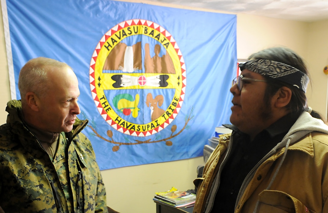 Maj. Gen. John M. Croley, commanding general of the 4th Marine Aircraft Wing, speaks with the vice chairman of the Havasupai tribal council, Matthew Putesoy Sr., during a visit Dec. 15, 2009, to the village of Supai, Ariz., located within the Grand Canyon. For 14 years, Marine Medium Helicopter Squadron 764, a reserve unit within 4th MAW, airlifted donated Christmas gifts to the tribe's children as part of the Toys for Tots program. Besides airlift, the only way to reach the village is via an eight-mile foot trail. The squadron is based at Edwards Air Force Base north of Los Angeles.
