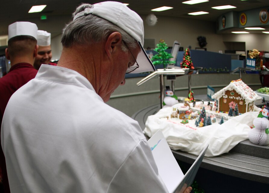 Bob Rice, the National Restaurant Association's civilian evaluator for the Maj. Gen. W. P. T. Hill Food Service Excellence Award, examines the appearance of the dining area in the Lance Cpl. Chance R. Phelps Mess Hall Dec. 16.
