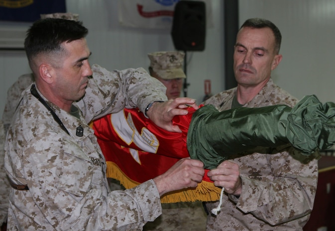 Master Gunnery Sgt. Norman Hoosier (left), the operations chief and senior enlisted staff non-commissioned office with Combat Logistics Regiment 27 (Forward), and Col. Vincent A. Coglianese (right), the commanding officer of CLR-27 (Fwd), perform the casing of the regiment’s colors during a Transfer of Authority ceremony aboard Al Asad Air Base, Iraq, Dec. 16, 2009.  Lt. Col. Eric Davis, the commanding officer of CLB-46, took over as the logistics combat element for Col. Vincent A. Coglianese, the commanding officer of CLR-27 (Fwd).  (U.S. Marine Corps photograph by Lance Cpl. Melissa A. Latty)