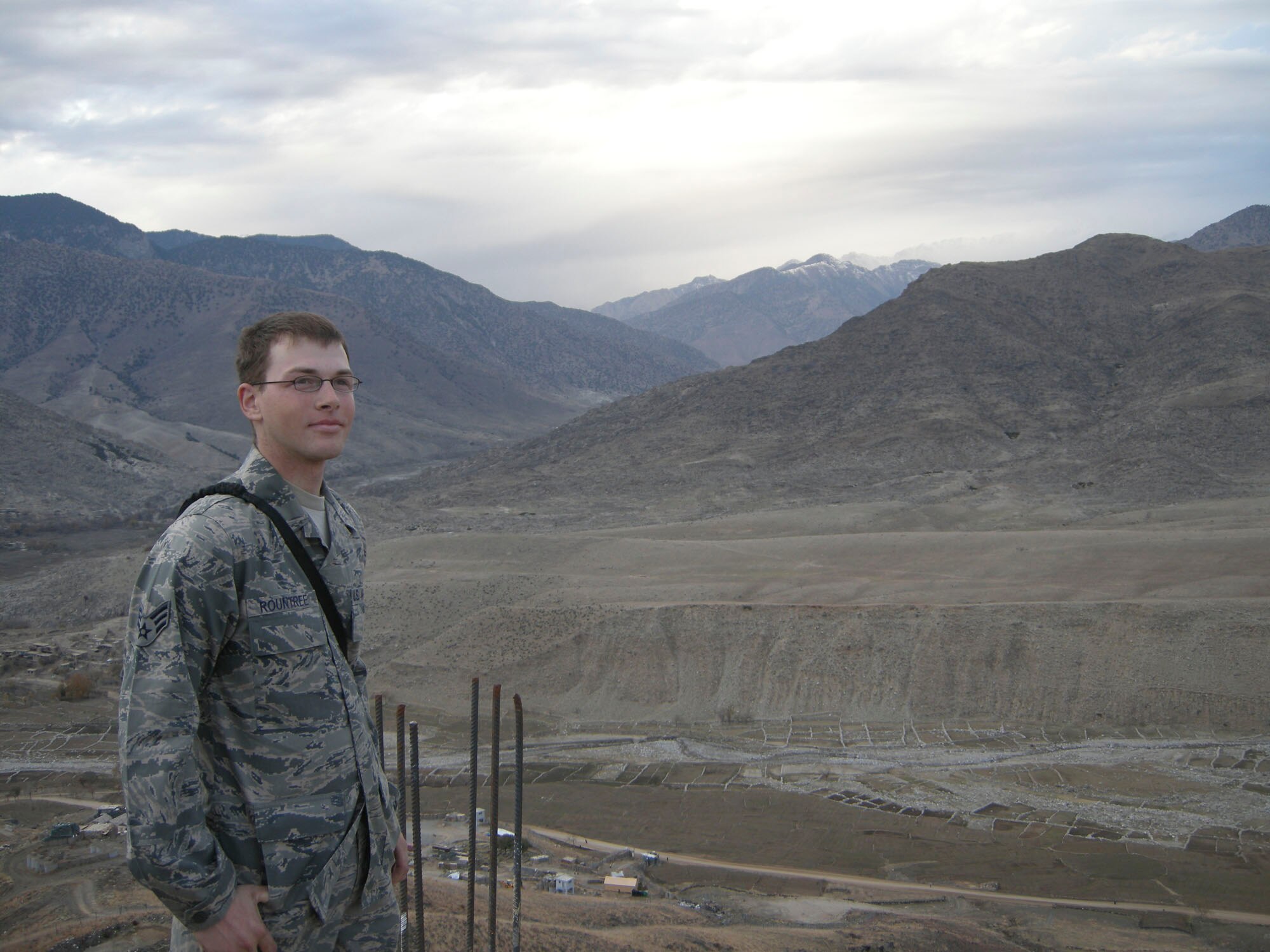 EASTERN AFGHANISTAN - Senior Airman Randell Rountree takes a break to get a good view of the mountains at his remote location. Airman Rountree is deployed from the 1st Communication Squadron, Langley Air Force Base, Va., is the one Airman that Soldiers depend upon for all of their internet and telephone communications from their Combat Outpost. (U.S. Air Force photo/Master Sgt. Todd Triplett)