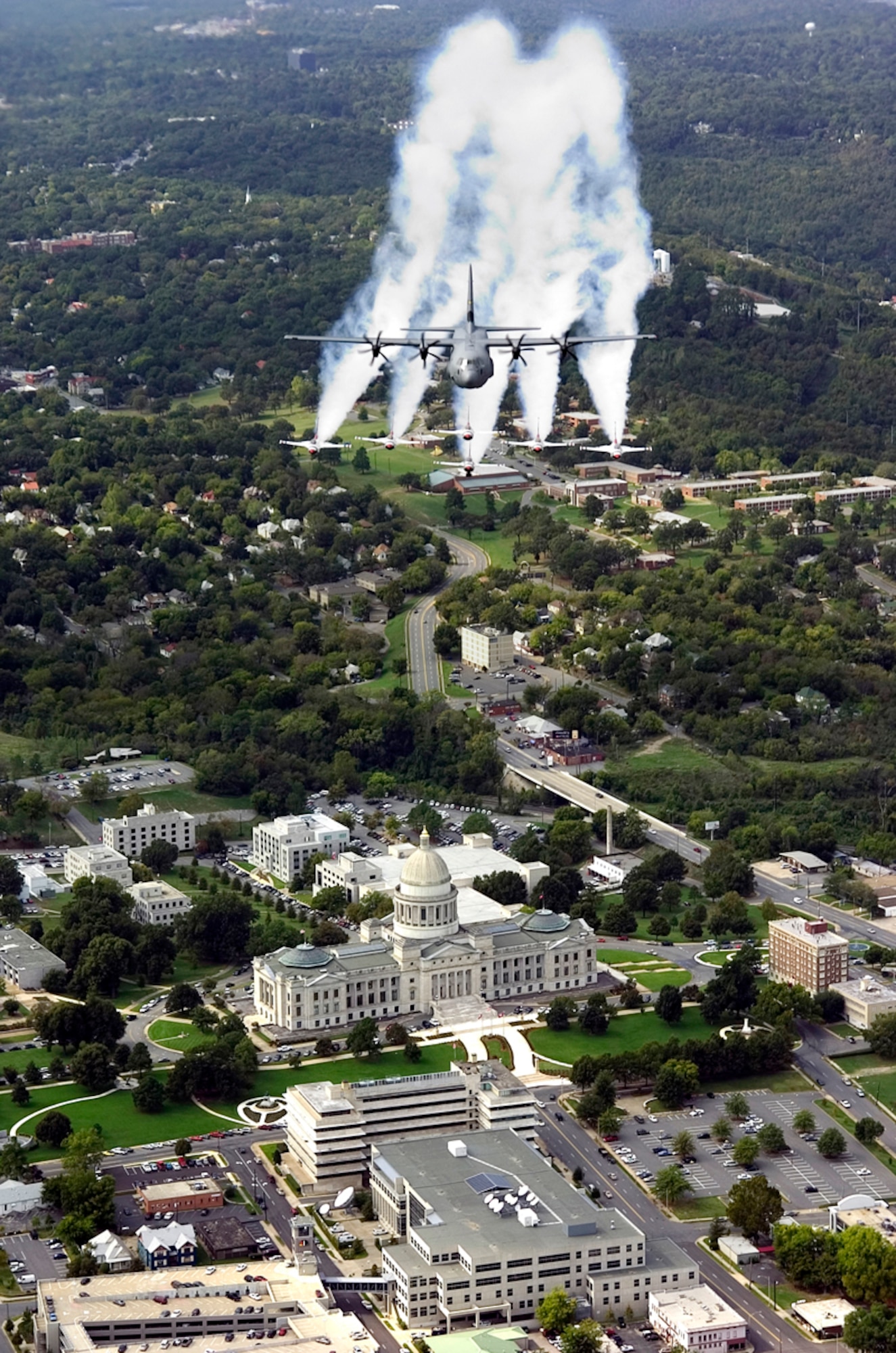 A C-130J Super Hercules and the Air Force Demonstration Team, the Thunderbirds, soar over the Arkansas State Capitol in this 2005 file photo.