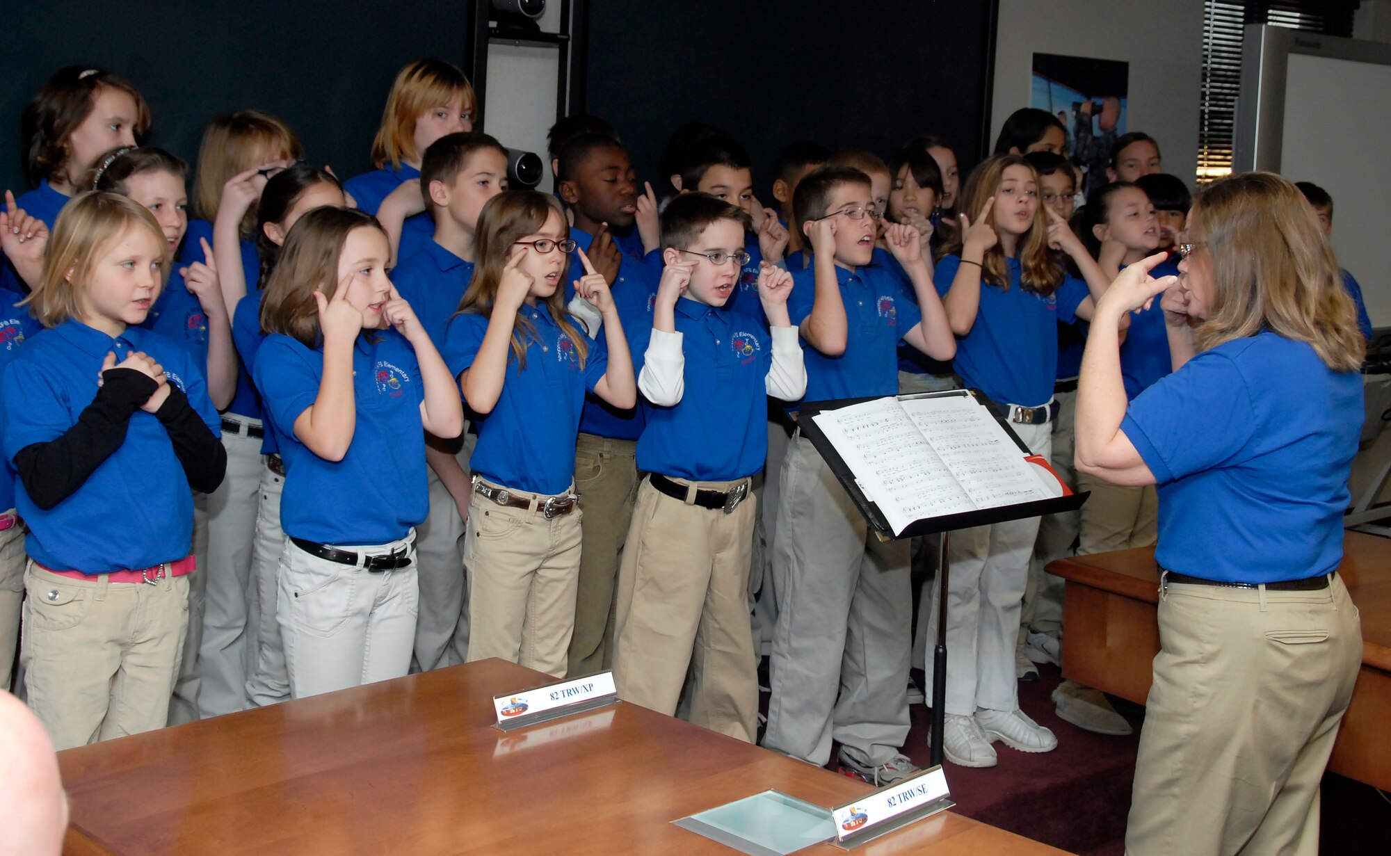 The Sheppard Elementary School Choir performs in the Wing Conference Room Dec. 16 during the 82nd Training Wing staff meeting. The choir performed at several locations around the base and downtown Wichita Falls, Texas. (U.S. Air Force photo/Mike Litteken) 