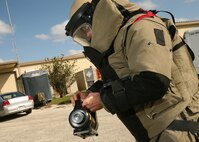 Staff Sgt. Scott Cameron sets up the XRS-3 X-ray generator for remote operation. The XRS-3 takes X-rays of targets so explosive ordnance disposal technicians can identify any hazards inside. Sergeant Cameron is an EOD technician with the 37th Civil Engineer Squadron. (U.S. Air Force photo/Robbin Cresswell)