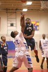 Warhawk Damon Turner closes out an open lane to the basket Dec. 12 during Lackland's first of four games played in the Joe Hall Tournament. (U.S. Air Force photo/Robbin Cresswell)