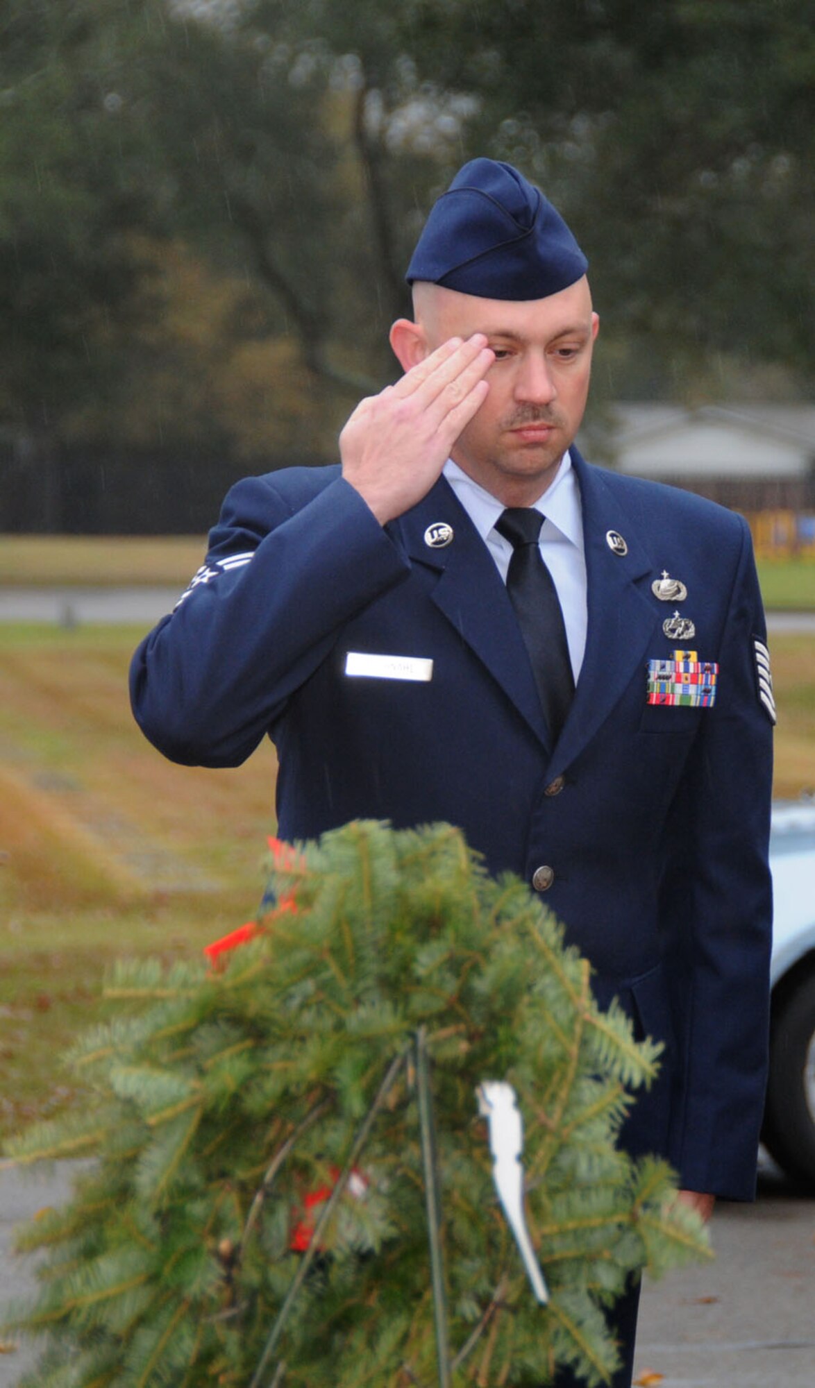 Tech. Sgt. Bryan Dochnahl, 81st Force Support Squadron, represented the Air Force at a Wreaths Across America ceremony Saturday at Biloxi National Ceremony sponsored by the Keesler Civil Air Patrol. Among Keesler’s other representatives
were Brig. Gen. Ian Dickinson, 81st Training Wing commander, and Col. Christopher Valle, vice commander, and his wife, Mary. This is the fourth year of the national campaign that brings remembrance wreaths to more than 230 national and state veterans’ cemeteries and memorials across the nation. The Keesler Civil Air Patrol received an extra 50 wreaths this year and placed them at all section entrances of the cemetery and at the most recent graves of soldiers killed in Iraq and Afghanistan. Ceremonical evergreen wreaths honoring the Army, Navy, Air Force, Marines, Coast Guard, Merchant Marines and all prisoners of war and soldiers missing in action were also placed. A ceremony was also held at the Vietnam Veterans Memorial in Ocean Springs, with a color guard from Keesler’s Naval Aviation Technical Training Unit.  (U.S. Air Force photo by Tech. Sgt. Chuck Marsh)