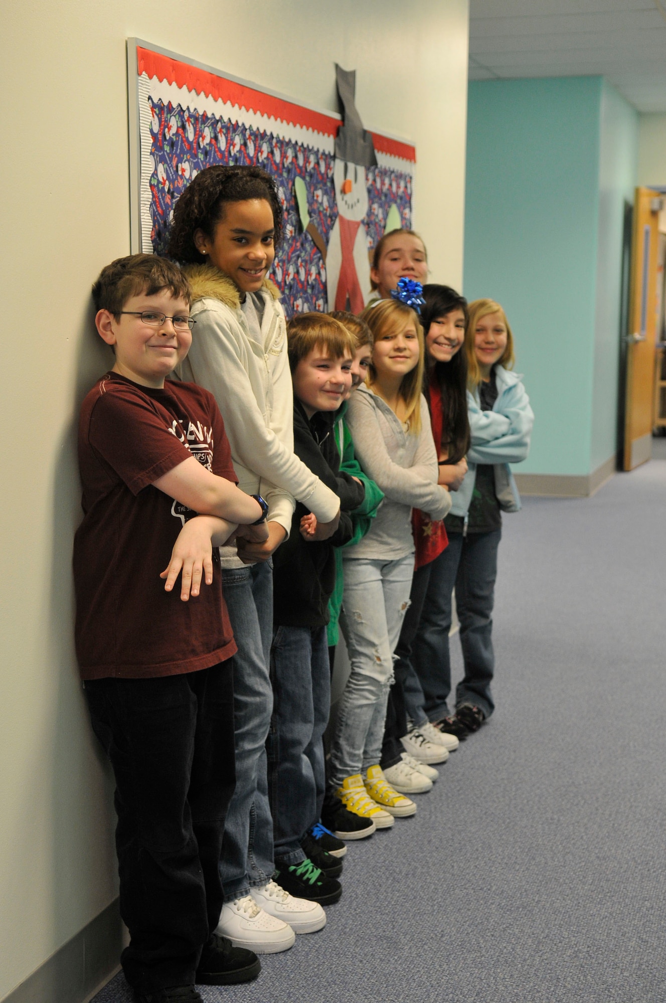 Students hold hands to demonstrate ways to show unity Dec. 15, 2009, Eielson Air Force Base, Alaska. The students gave their opinions in a questionnaire highlighting good will and happiness during the holidays. The students are in Mrs. Ellingson's 5th grade class at Crawford Elementary School. (U.S. Air Force photo/Airman 1st Class Janine Thibault) 