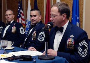 LANGLEY AIR FORCE BASE, Va. -- Chief Master Sgt. Terry Rethamel, Chief's Group president, reviews the history of the rank of chief master sergeant, during the enlisted dining in Dec. 11. This rank was introduced into the United States Air Force Dec. 1, 1959. (U.S. Air Force photo/Staff Sgt. Jeff Nevison)