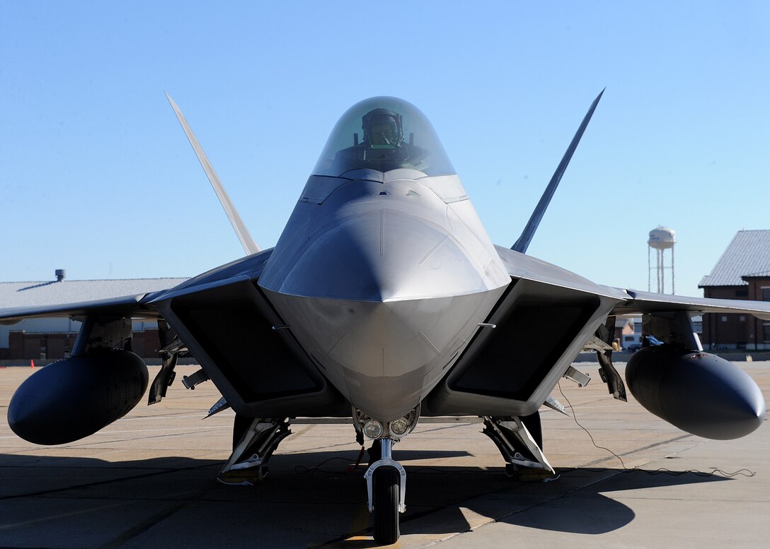 LANGLEY AIR FORCE BASE, Va. -- Lt. Col. David Abba waits for the signal to exit his aircraft after returning from a deployment Dec. 16. The 27th FS deployed six F-22 Raptors in support of a 40-day training exercise in southwest Asia. (U.S. Air Force photo/Airman Rebecca Montez) 