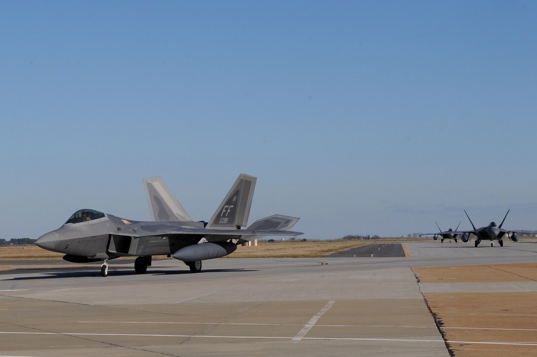 LANGLEY AIR FORCE BASE, Va. -- Three F-22A Raptors from the 27th Fighter Squadron taxi in after returning from a deployment here Dec. 16. The 27th FS deployed six aircraft in support of a 40 day training exercise in Southwest Asia. (U.S. Air Force photo/Airman Rebecca Montez)