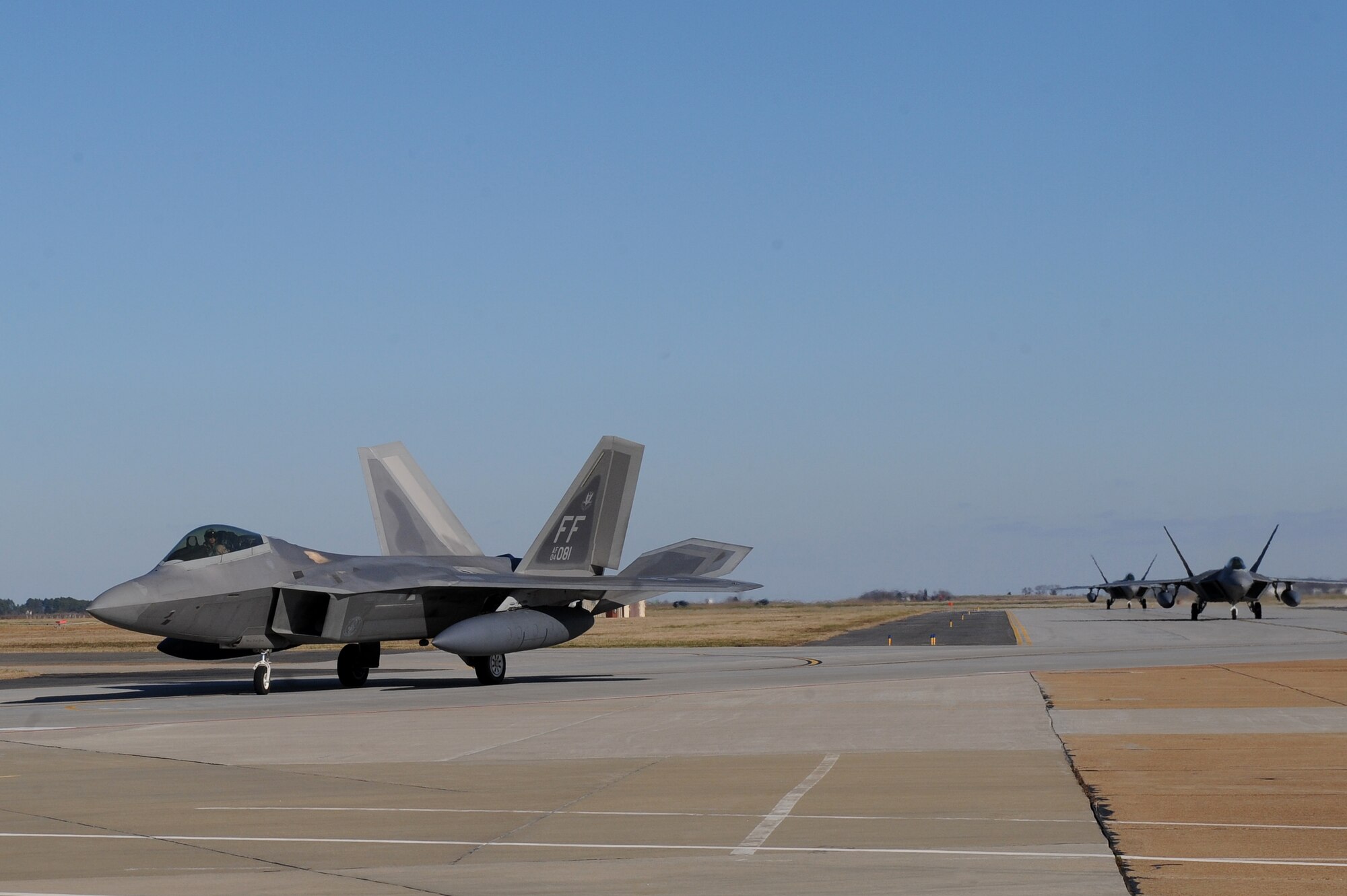 LANGLEY AIR FORCE BASE, Va. -- Three F-22A Raptors from the 27th Fighter Squadron taxi in after returning from a deployment here Dec. 16. The 27th FS deployed six aircraft in support of a 40 day training exercise in Southwest Asia. (U.S. Air Force photo/Airman Rebecca Montez)