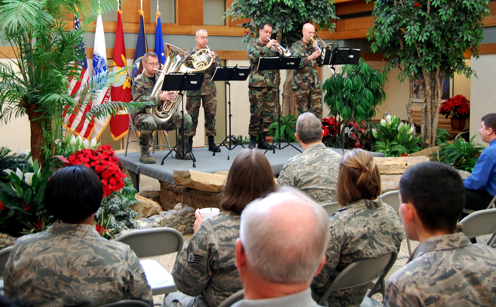 The Air Force Heritage Band Brass Quartet entertains members of the Air Force Mortuary Affairs Operations Center with Christmas carols Dec. 16. (U.S. Air Force photo by Ed Drohan, AFMAO/PA)