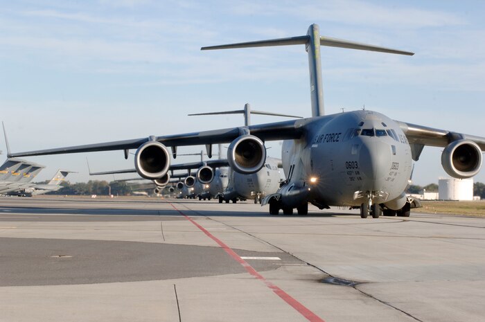 C-17 aircraft from Charleston AFB taxi prior to take-off in preparation for a strategic brigade airdrop exercise over North Auxiliary Airfield near North, S.C., Dec. 16. Airborne Soldiers from the 2-319th Airborne Field Artillery, 82nd Airborne Division, Ft. Bragg, N.C., were airdropped in the exercise along with cargo pallets to simulate the seizure of a remote airfield, providing a joint training opportunity for the Airmen and Soldiers. The training mission included airdrops over North Auxiliary Airfield, aerial refueling training and simulated aeromedical evacuation. (U.S. Air Force photo/Staff Sgt. Marie Brown)(RELEASED)