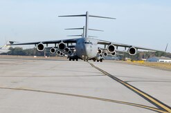 C-17 aircraft from Charleston AFB taxi prior to take-off, in preparation for a strategic brigade airdrop exercise over North Auxiliary Airfield near North, S.C., Dec. 16, demonstrating the global projection of U.S. airpower. Airborne Soldiers from the 2-319th Airborne Field Artillery, 82nd Airborne Division, Ft. Bragg, N.C., were airdropped in the exercise along with cargo pallets to simulate the seizure of a remote airfield, providing a joint training opportunity for the Airmen and Soldiers. The training mission included airdrops over North Auxiliary Airfield, aerial refueling training and simulated aeromedical evacuation. (U.S. Air Force photo/Staff Sgt. Marie Brown)