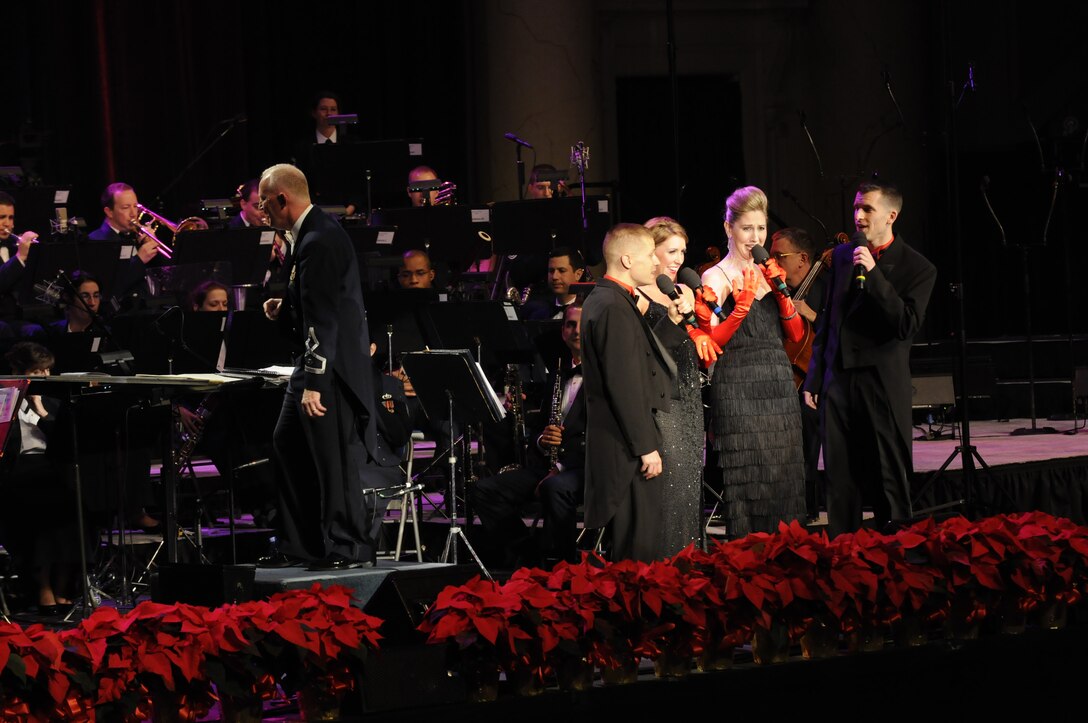 Master Sgt. Ryan Dolan, Senior Master Sgt. Christine Germain, and Master Sgts. Janice Carl and Matthew Irish were featured in a medley of songs from Irving Berlin’s “White Christmas”.  This year’s holiday program, “Hooray for Holidays”, took place at Daughter’s of the American Revolution Constitution Hall in Washington, D.C., and featured holiday music from stage, television, and movies.  (Photo by SrA Tim Chacon)