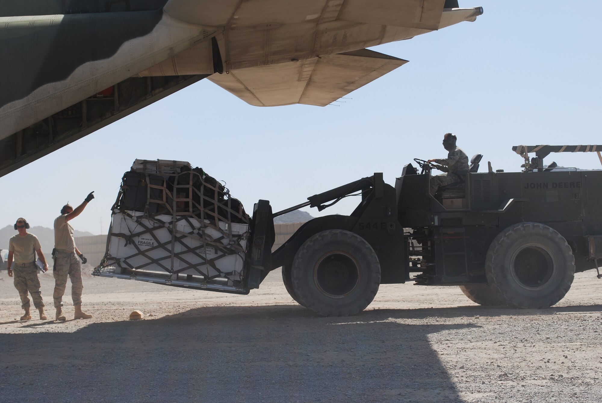 Recently, more than 100 members of the 615th Contingency Response Wing deployed to two of the most remote forward-operating bases in western Afghanistan. Working with local nationals, joint and coalition forces, the wing quickly established and maintained airfield operations at forward operating bases Farah and Shindand. During a three-month period, Airmen handled more than 900 aircraft, moved more than 6,000 passengers and 4,500 tons of critical supplies to support U.S. and coalition campaigns against the Taliban. Whether supporting humanitarian operations or contingencies, the 615th CRW’s team of experts are fully trained and equipped to respond within 12 hours to any location around the world. (U.S. Air Force Photos/Capt. Paradon Silpasornprasit)