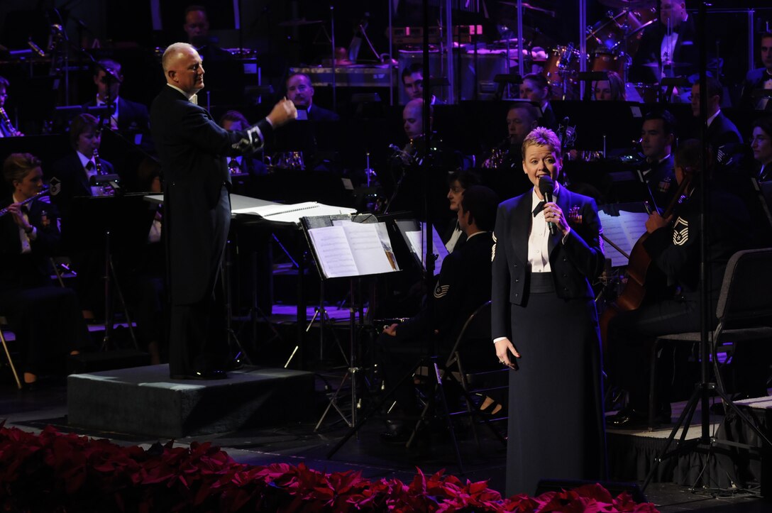 Senior Master Sgt. Angela Burns, the Music Director of The Singing Sergeants, sings “Where are you Christmas?” from the movie “The Grinch”.  This year’s holiday program, “Hooray for Holidays”, took place at Daughter’s of the American Revolution Constitution Hall in Washington, D.C., and featured holiday music from stage, television, and movies.  (Photo by SrA Tim Chacon)