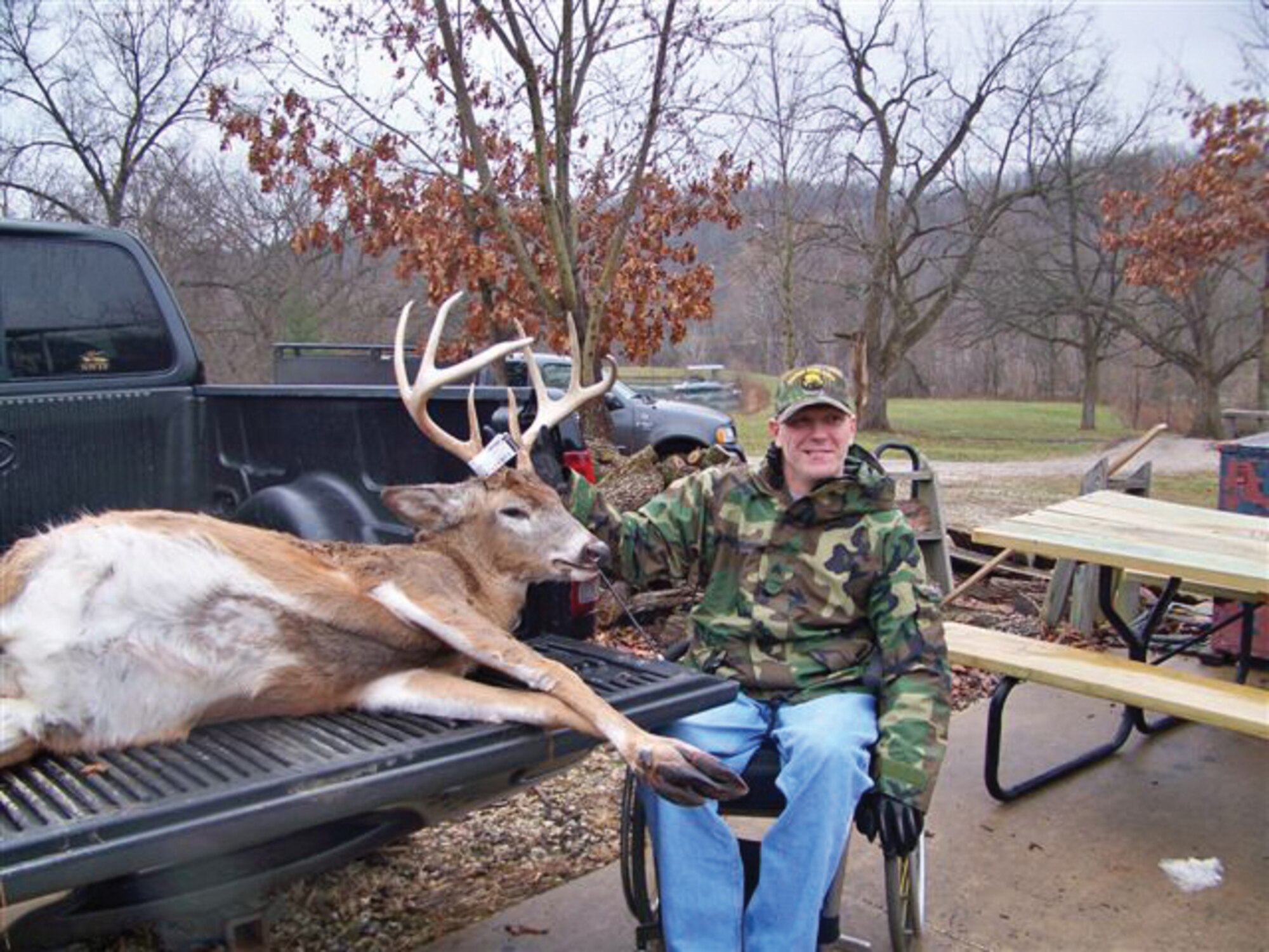 PIKE COUNTY, Ill. -- Army Sgt. Joe Jenkins displays the buck he shot last weekend in Pike County, Ill.  Sergeant Jenkins and Army Spc. Matt Houston went on a wounded warriors hunt hosted by area hunters.(Courtesy Photo)