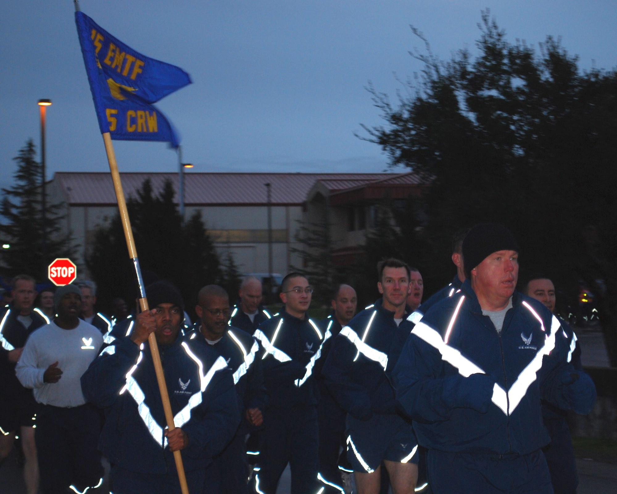 615 CRW warrior run promotes fitness and honors sacrifices 
Col. John Lipinski, 615th Contingency Response Wing commander, right, leads nearly 600 members of the 615th CRW on Dec. 7 on a 1.5 mile course during the unit’s warrior run. The event began and ended at the Global Reach Deployment Center and promoted fitness and esprit de corps. The event also was scheduled on this day to remember the sacrifices made by Airmen 68 years ago at Pearl Harbor. (U.S. Air Force photo)
