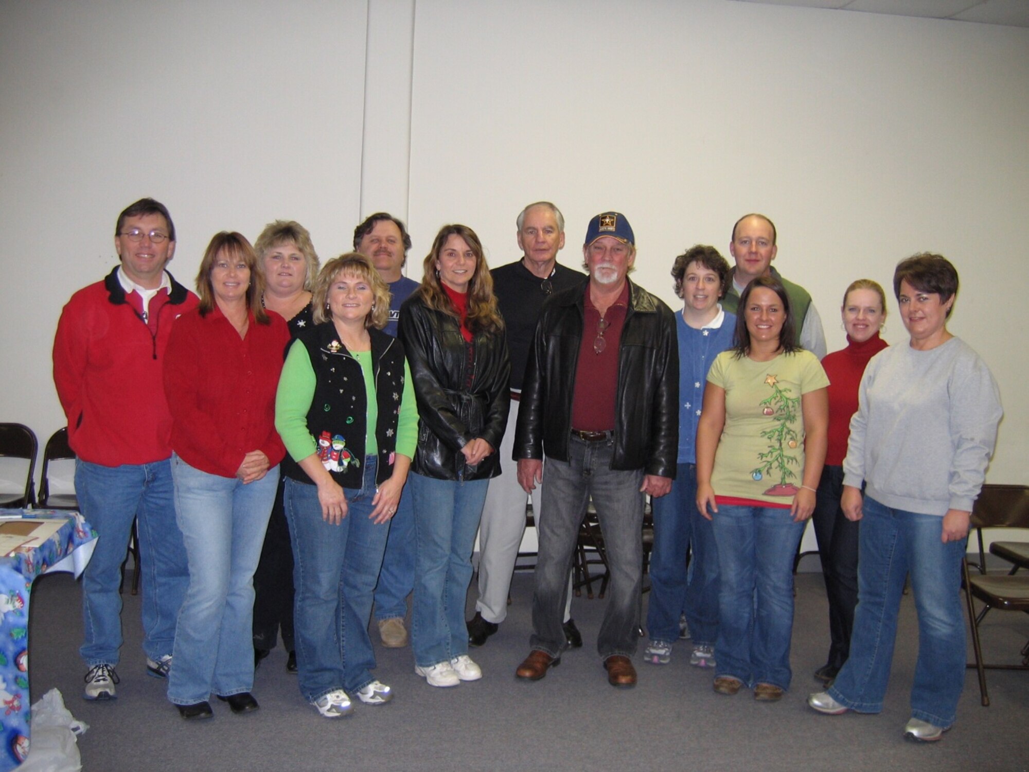 Several Arnold Engineering Development Center volunteers participated in the Kids for Christmas program this past weekend. Those pictured in the back row are John Gilmer, Annette Painter, Gerald Stone, Lloyd Ballard, Tracey and Tim Dimon and Carrie Barham. In the front row is Glenda Perry, Carletta Hickerson, Rita Pope and Doug Pope, Holly West and Mary Alice West. (Photo provided)