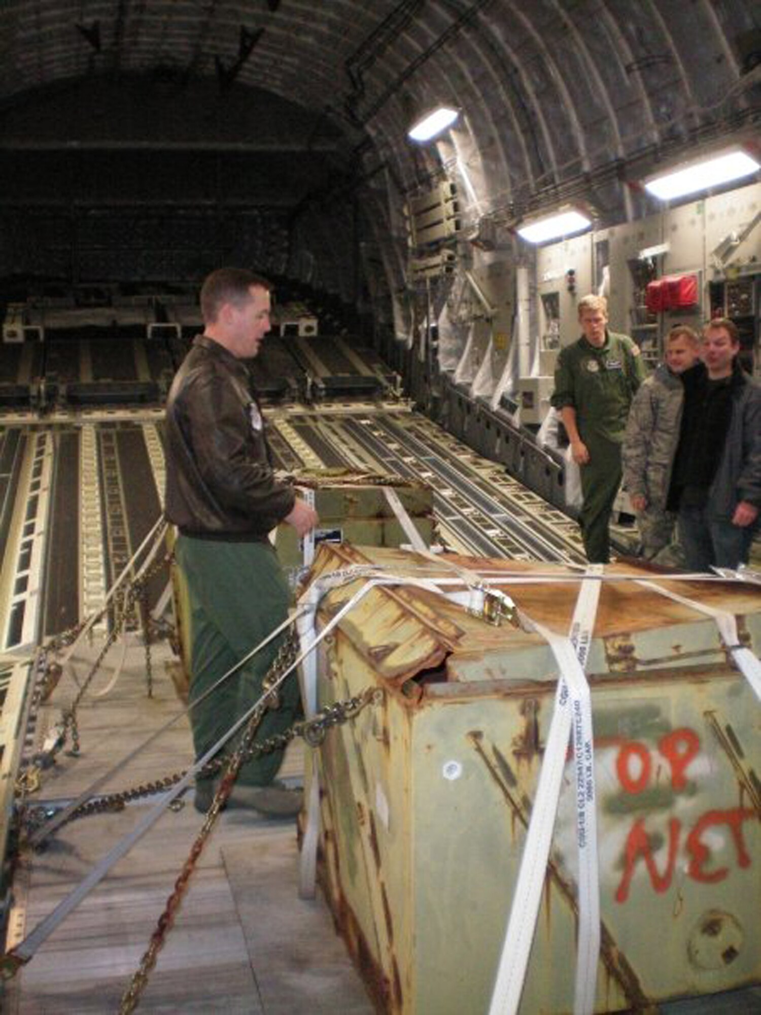 Lt. Col. Kevin Gordon, 3rd Airlift Squadron commander, takes members of the Leadership Central Delaware from the Central Delaware Chamber of Commerce on a tour of the inside of a C-17 Globemaster III Dec. 7 before taking them on an orientation flight. Colonel Gordon was the pilot of the flight as well as a participant in Leadership Central Delaware. (Courtesy photo)