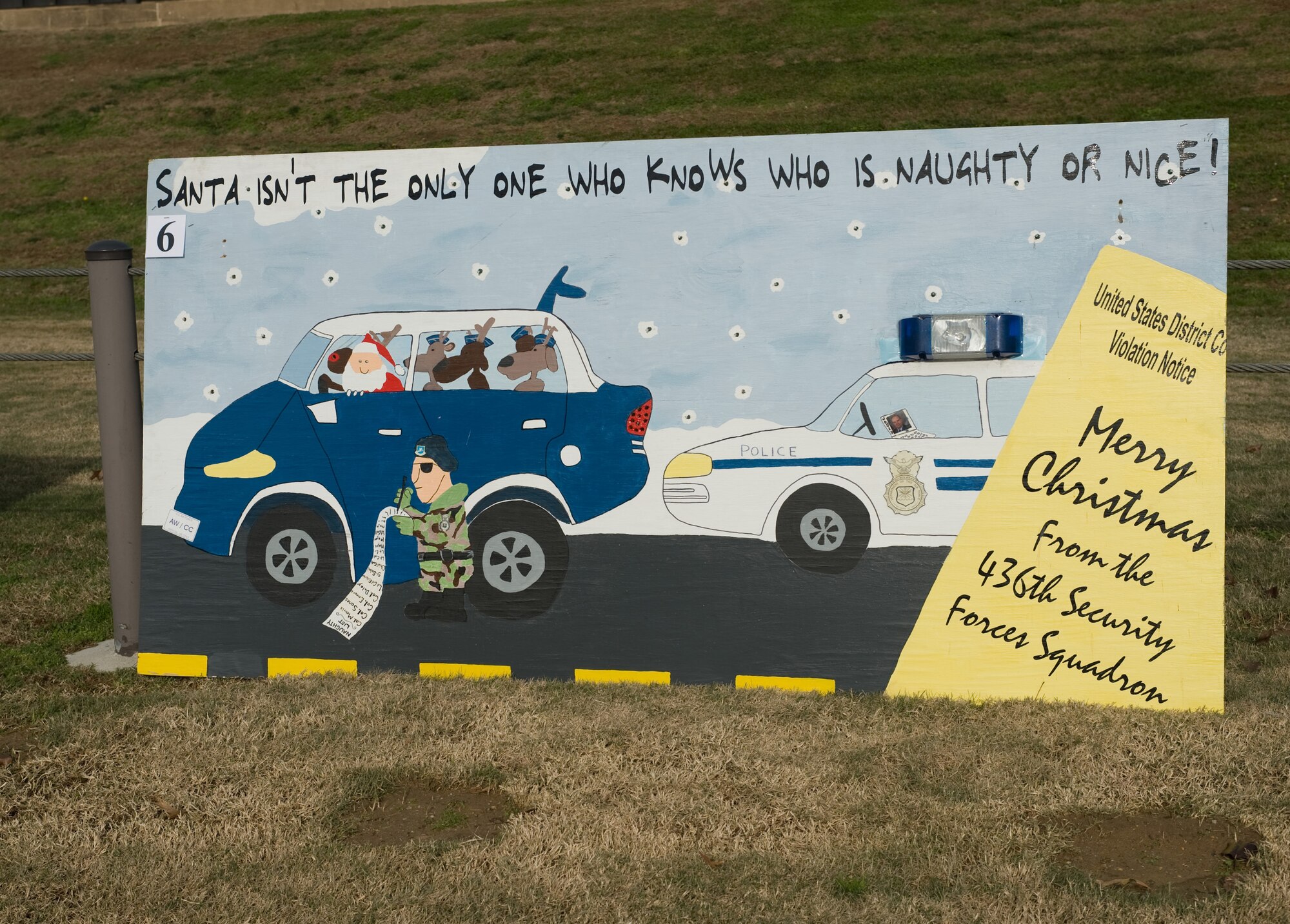 The 436th Security Forces Squadron won the Holiday Card Lane competition Dec. 14.  The 436th Medical Group took second place, and the 436th Civil Engineer Squadron rounded out the top three.  Leadership from the 436th Airlift Wing judged the cards based on content and adherence to the contest rules. (U.S. Air Force photo/Brianne Zimny)